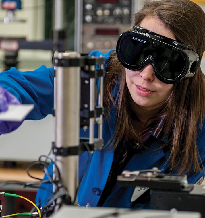 Young woman using a microscope