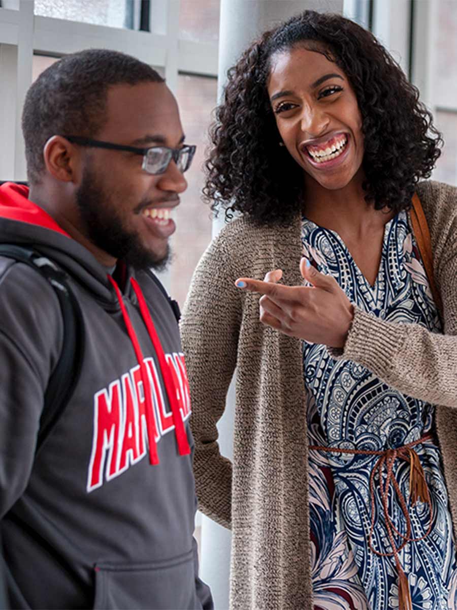 Two students laughing